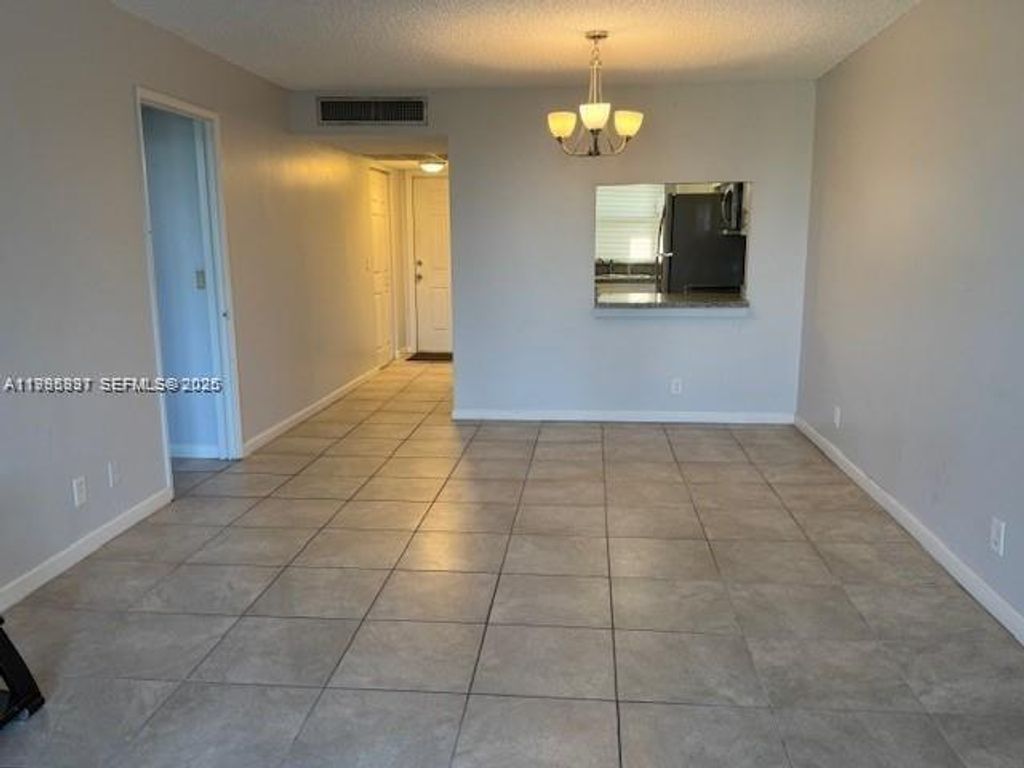 Photo of 9421 Evergreen Pl #403, Davie, FL 33324 (MLS # A11995897)