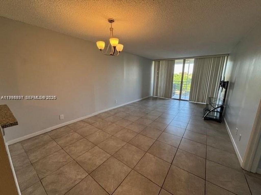 Photo of 9421 Evergreen Pl #403, Davie, FL 33324 (MLS # A11995897)