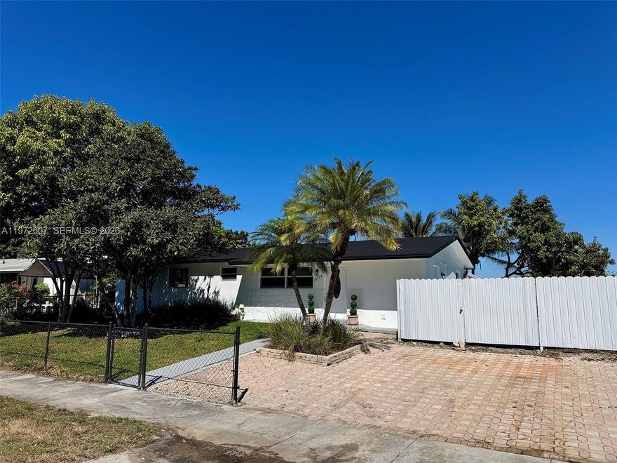 Bring your toothbrush! This one is completely remodeled. Be the very first to experience the brand new kitchen with stainless steel appliances and large island. Yes, there is a new garbage disposal. Huge bo-nus room (approximately 400 sf!) overlooking the green backyard with calming palms. Bathroom features oversized shower with glass enclosure. Tankless HWH. New impact windows. LED ceiling lighting in every room. Consistent, new laminate floors with wood grain look. Separate laundry room with brand new washer and dryer. You'll love it!