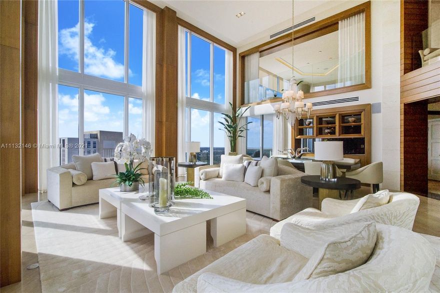 This uniquely designed contemporary condominium situated along the banks of the New River in Ft Lauderdale has the esteemed distinction of being one of the tallest building in Broward County, Florida. Stunning 3 story penthouse, 4 bedrooms & 5 an 1/2 bathrooms. Private Elevator, Floor-to-Ceiling Windows with Breathtaking Views of the city skyline, Las Olas and Ocean. This PH has 6,912 sq. ft. of Living Space with volume ceilings impeccable attention to detail, Interiors designed by Steven G and featured on high end design magazines. Staircase has a 3 story breathtaking Chandelier. 3,300 sq. ft. of Roof Top & Other Balconies. 5-Star Amenities building w/ Spectacular Spa-Gym, Bistro, Library & Heated Infinity Pool. PH Includes Its Own Cabana, storage and 2-Premier Parking Spaces plus Valet.