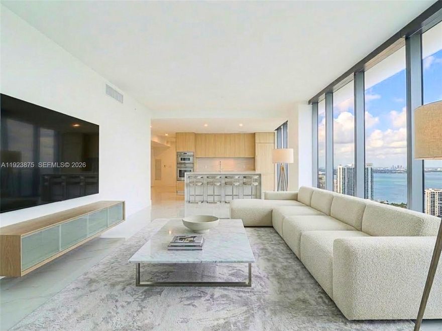 Step into refined luxury in the heart of Edgewater. This exceptional 4-bedroom plus den residence is fully upgraded and showcases custom built-in closets, automatic blinds throughout, floor-to-ceiling windows, and sweeping panoramic views. Thoughtfully finished with sleek, high-end materials, the home is set within a brand-new full-service luxury building offering resort-style, hotel-caliber amenities. Perfectly positioned just minutes from Wynwood, Midtown, the Design District, and Downtown Miami, this is a rare opportunity to be the first to call a truly remarkable residence home.