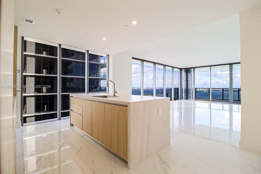 Step into refined luxury in the heart of Edgewater. This exceptional 4-bedroom plus den residence is fully upgraded and showcases custom built-in closets, automatic blinds throughout, floor-to-ceiling windows, and sweeping panoramic views. Thoughtfully finished with sleek, high-end materials, the home is set within a brand-new full-service luxury building offering resort-style, hotel-caliber amenities. Perfectly positioned just minutes from Wynwood, Midtown, the Design District, and Downtown Miami, this is a rare opportunity to be the first to call a truly remarkable residence home.