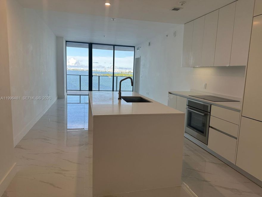 Experience the best of waterfront living at Aria Reserve Miami, Edgewater’s newest luxury address. This never-occupied 1 Bedroom + Den, 2 Bath home features expansive glass walls, modern design, and a private balcony with endless views of Biscayne Bay, Downtown Miami, and Miami Beach. The versatile den offers the perfect space for a home office or guest room. Residents enjoy over 2 acres of lifestyle amenities, including a bayfront park with Baywalk, multiple pools, wellness spa, fitness pavilion, wine lounge, kids’ and game rooms, dog spa, as well as tennis, basketball, pickleball, paddleball, squash, mini golf, and private marina access. Located in the heart of Edgewater, just minutes from Wynwood, the Design District, Brickell, and the beaches.