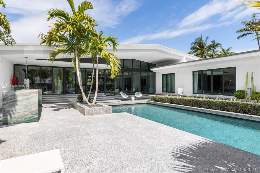 HOUSE ALSO FOR RENT. Luxury Miami living is yours in this waterfront estate. This impressive residence has been meticulously renovated with high-end and top of the line finishes throughout. Only minutes to the best restaurants and shopping of South Beach, as well as the MB golf course and the ocean! The two-year renovation was orchestrated by renowned French architect/designer Jean-Louis Deniot (of Elysee Condo in Miami, Nolinsky Hotel in Paris and Waldorf Astoria NYC fame), who originally built this for himself. Includes vaulted 14 ft ceilings, 2 marble wet-bars, fire feature, complete sliding front & back sliding doors. A modern kitchen, Wolf & SubZero, Dornbracht, Lutron, security cameras, heated pool, dock, and seawall.