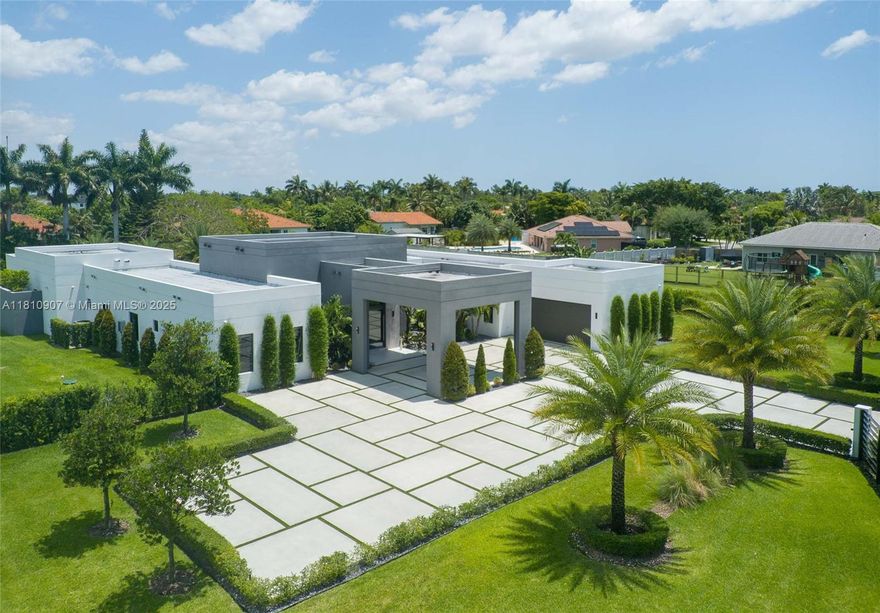 Opportunity to own a FULLY FURNISHED, Turnkey luxury estate located in one of Miami's most sought-after and rapidly appreciating neighborhoods. Situated on a 1.05 acre lot, this 2023-built residence features 5 beds/5.5 baths with 4,306 Sq Ft of living space designed with attention to detail and premium materials throughout. The estate has been upgraded with premium enhancements, including remote-controlled retractable screens on the backyard terrace, custom privacy fencing with mature plantings, architecturally designed outdoor lighting, high-end indoor and outdoor furniture, a pool water heater, and outdoor security system with HD cameras and photo beam sensors. A brand new luxury mansion is currently under construction next door, further enhancing the neighborhood's value and exclusivity