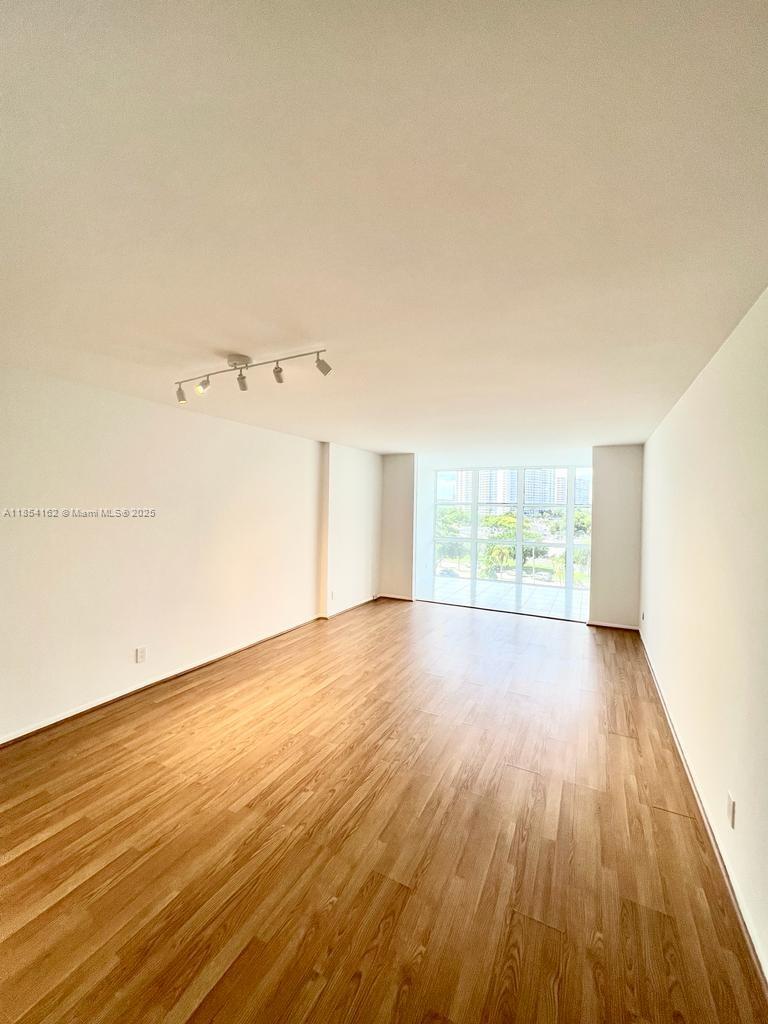Enjoy stunning intracoastal views from this bright 6th-floor unit featuring floor-to-ceiling windows. This impeccably maintained 1-bedroom, 1.5-bath residence (915?sqft) is move-in ready. Currently rented to a great tenant with flexibility for end-user occupancy. Resort-style living includes a waterfront pool, fitness center, tennis courts, 24-hour security, attended lobby, and assigned parking. Located in the gated Three Islands community, just minutes from the beach, Gulfstream Park, restaurants, Aventura Mall, and the Brightline station. Perfect for end-users or investors alike—an exceptional opportunity in a prime location!