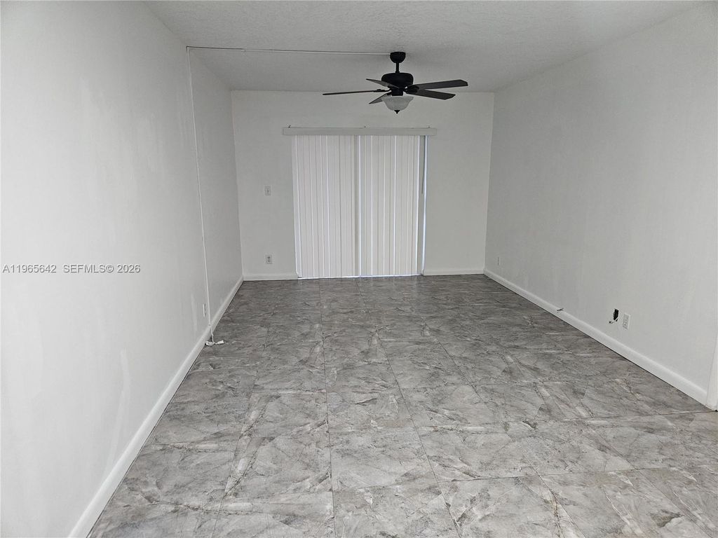 Photo of 7610 Stirling Rd #102C, Davie, FL 33024 (MLS # A11965642)