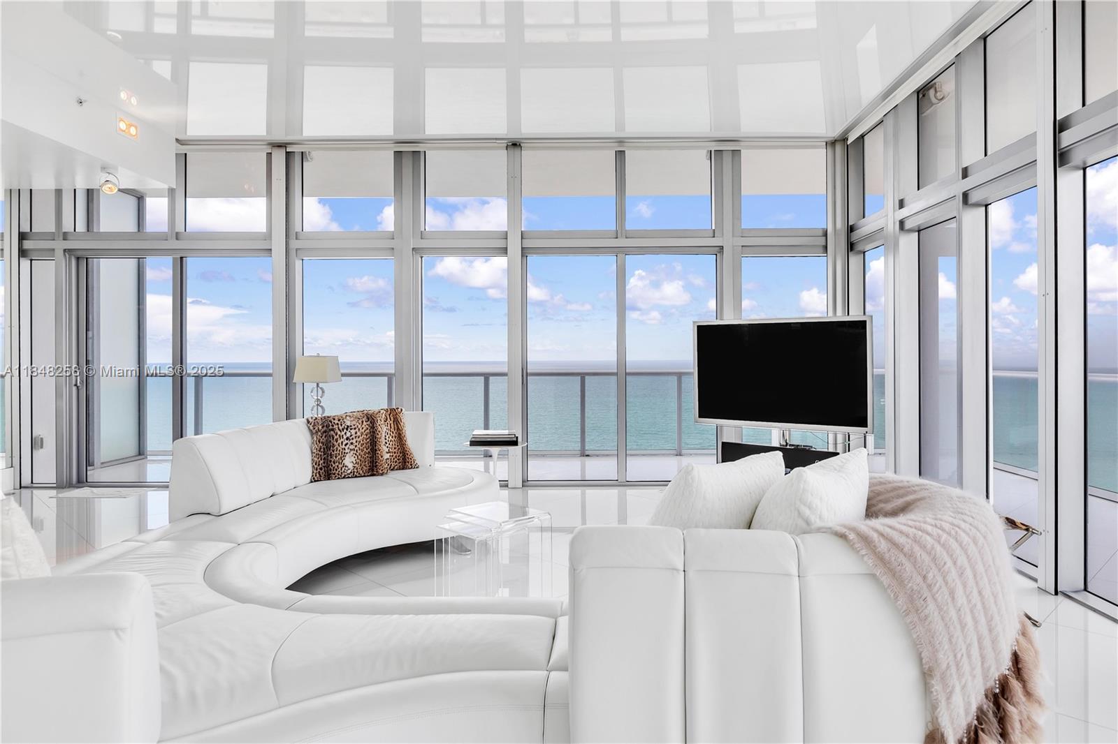 Spanning entire Southern side of The Caribbean, PH-1 boasts nearly 4,000 sqft of sheer beauty & privacy. Dream-worthy views of the Ocean reflect throughout the over-sized living area, comprised of over 16 impact windows. 12 ft ceilings throughout. 2 private elevators open directly into foyer. Primary suite encompasses the entire Western corner, floor to ceiling glass throughout. Dual vanities/toilets in Primary. Lutron lighting & shade automation, speakers throughout balconies, hidden projection screen, dual gas stove, en-suite baths for each bed. Caribbean is a boutique building, offering luxuries of a full-service building. Beach chairs & towel service. Fitness center fully equipped. 2 valet parking spaces. Walk to Faena, SoHo, Edition. Quick drive to Airport.