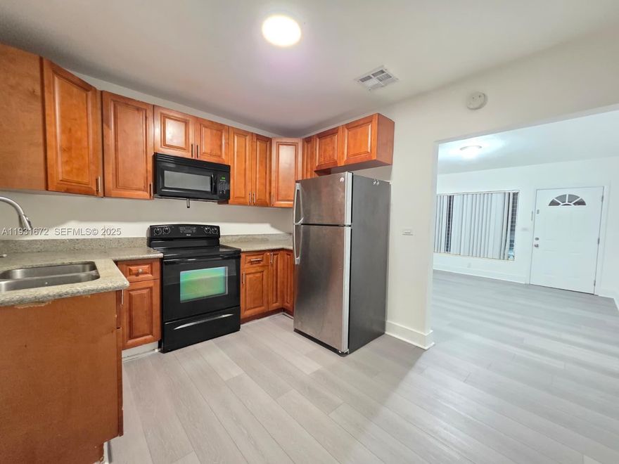 Quite, beautiful and spacious unit. This is a duplex with an immense backyard with avocado trees. No assoc, fast approval. This is a very quiet street, only blocks from biscayne blvd. Private laundry.