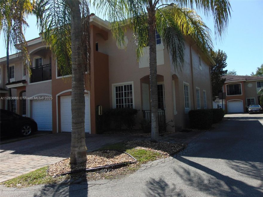 Well-Maintained TOWNHOME W/ GARAGE in GATED Hallandale Beach Community. This beautiful townhome is just minutes from Gulfstream Park & the beach. The SPACIOUS CORNER UNIT offers an OPEN FLOORPLAN and is right across from the COMMUNITY POOL. Kitchen features GRANITE COUNTERTOPS & STAINLESS STEEL APPLIANCES w/ LARGE WOOD CABINETS. OVERSIZED MASTER BEDROOM W/ BALCONY view of community pool. TILE FLOORS DOWNSTAIRS & CHERRY WOOD FLOORS UPSTAIRS. The private, fenced patio is perfect for relaxing or entertaining guests. Home also features a NEWER A/C and IMPACT WINDOWS for added comfort & safety. The UPSTAIRS LAUNDRY ROOM adds convenience. The HOA fee covers EXTERIOR MAINTENANCE & COMMON AREAS. This townhome is ideal for both relaxation & entertaining—come see it TODAY! *READ BROKER'S REMARKS*