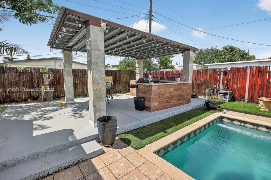 Charming home boasting the largest square footage in the neighborhood. The impressive backyard features a pool, built-in grill, and bar—perfect for entertaining or relaxing. A separate guest unit offers excellent rental or guest accommodations. Roof replaced in 2025! All impact windows. 3 Bedrooms at the main house plus a guest house bedroom with the full bath..