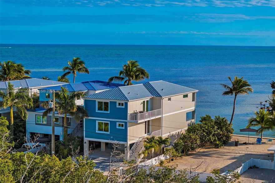 Coastal Luxury with Breathtaking Views on the Edge of the Atlantic close to renowned Sombrero Beach.Unlike a lot of 'cookie-cutter' new homes for sale,this modern masterpiece is nestled on a quaint dead-end street having a 37.5 ft.concrete dock w/instant ocean access. Constructed with superior materials like Marvin hurricane impact windows and doors,durable metal roof,concrete floors and stairs.The popular elevator connects the garage to all living spaces.The main level boast a huge great room with it's expansive 21-foot glass opening flowing seamlessly onto the veranda.High ceilings and stylish shiplap in the Great Room showcase an open-concept chef's kitchen. Private yard features a concrete heated/chilled pool,shower and poolside bath.7-day vacation rentals permitted.NO HOA!