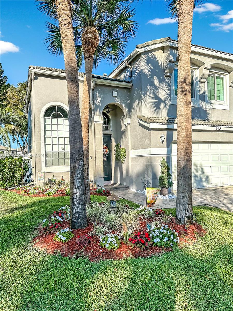 This beautiful 4-bedroom/2.5 bathroom home is located in the desirable community Madison Green. Home features: impact windows upstairs, hurricane shutter panels for downstairs, keyless front door entry, ring door bell, external cameras, outdoor speakers in patio, electric panel for portable power & rainsoft whole house water filtration system. Water heater & dishwasher recently replaced. Corner Cul-De-Sac Lot! This fully fenced lot is one of the largest in Pinehurst and has room for a pool. Enjoy outdoor living in your private oasis. Home features a covered and screened patio. Madison Green is renowned for its resort style living with beautiful surroundings and convenient location. Lots of amenities & basic cable & internet included.