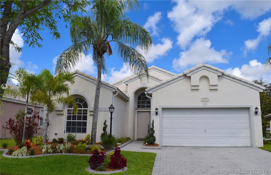 Bright Teakwood Model with open floor plan in the sought-after Pembroke Falls. This 3 bedroom/2 full bathrooms has tile floors throughout the entire house. BRAND NEW AC with programmable thermostat; BRAND NEW Stainless Steel LG Kitchen Appliances; French door refrigerator with door-in-door feature and bottom mount pull-out freezer drawer; BRAND NEW Samsung Washer and Dryer; Gas water heater and gas connection for outdoor BBQ. Accordion Shutters and fenced back yard. No neighbors in the back. Walking distance to the community club. Close to hospital, mall, restaurants, shopping centers and easy access to I-75. Security gate 24 hours. Homeowners Association fee includes internet, basic cable, monitoring of the alarm, maintenance of common areas and access to the amenities of the clubhouse.