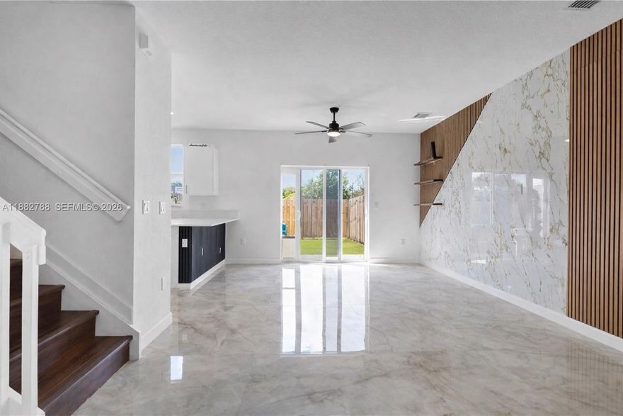 Beautifully upgraded new-construction townhome in Coral Springs. 

The main level features porcelain tile flooring and a custom LED-lit porcelain accent wall. 

Unlike other properties in the neighborhood, upstairs, all three bedrooms are finished with wood-style vinyl flooring, including the stairway, with no carpet. 

The primary suite includes a spacious walk-in closet.


Outdoor enhancements include a rock-finished front patio, an artificial turf backyard, and a built-in grill, creating an ideal setting for relaxation or entertaining. 

Located in a gated community with amenities that include a pool, jacuzzi, and walking path. Conveniently situated near top-rated schools, shopping, dining, and parks.