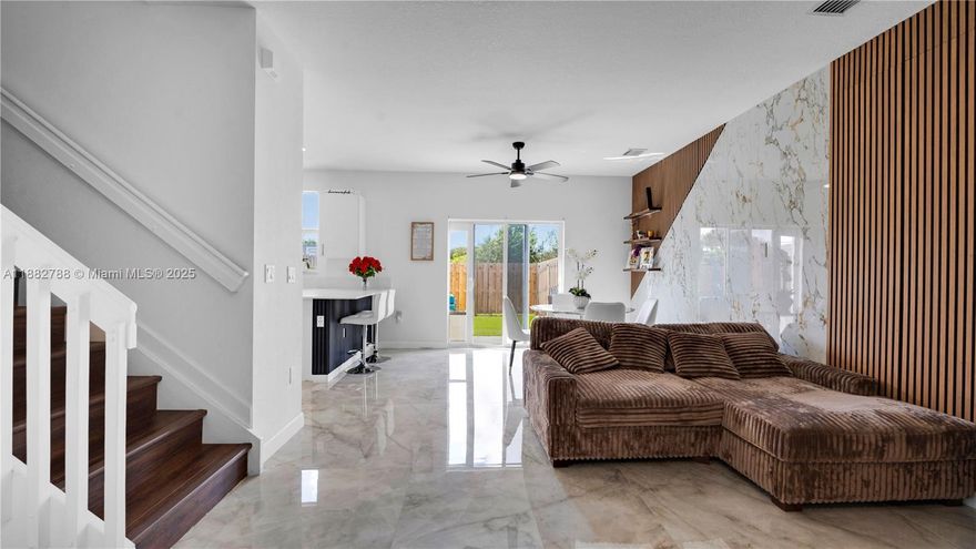 Beautifully upgraded new-construction townhome in Coral Springs. 

The main level features porcelain tile flooring and a custom LED-lit porcelain accent wall. 

Unlike other properties in the neighborhood, upstairs, all three bedrooms are finished with wood-style vinyl flooring, including the stairway, with no carpet. 

The primary suite includes a spacious walk-in closet.


Outdoor enhancements include a rock-finished front patio, an artificial turf backyard, and a built-in grill, creating an ideal setting for relaxation or entertaining. 

Located in a gated community with amenities that include a pool, jacuzzi, and walking path. Conveniently situated near top-rated schools, shopping, dining, and parks.