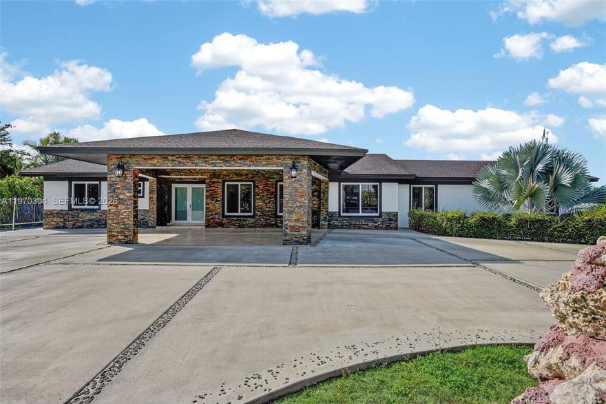 Amazing opportunity to own a house within the agricultural Suburbs, this home features 3 bed/2 bath at the main house , and 1 bed /1 bath casita or in law quarters perfect for extended family or to rent for extra income.The driveway is generously over sized circular with custom porte-cachere done 2 years ago.Outdoor oasis equipped with samsung appliances ,full kitchen ,wood cabinetry,granite countertoops in both kitchens and baths.Also half a bathroom outside.Polished marble floors throughout the interior.Outdoor living at its finest with custom built kitchen.Yellow pine tongue/groove ceilings with recessed lighting and travertine floors.All Impact and doors,aqua kleen water softnet/filter system. Wood composite fence ,fruit trees space for boat/RV.No HOA