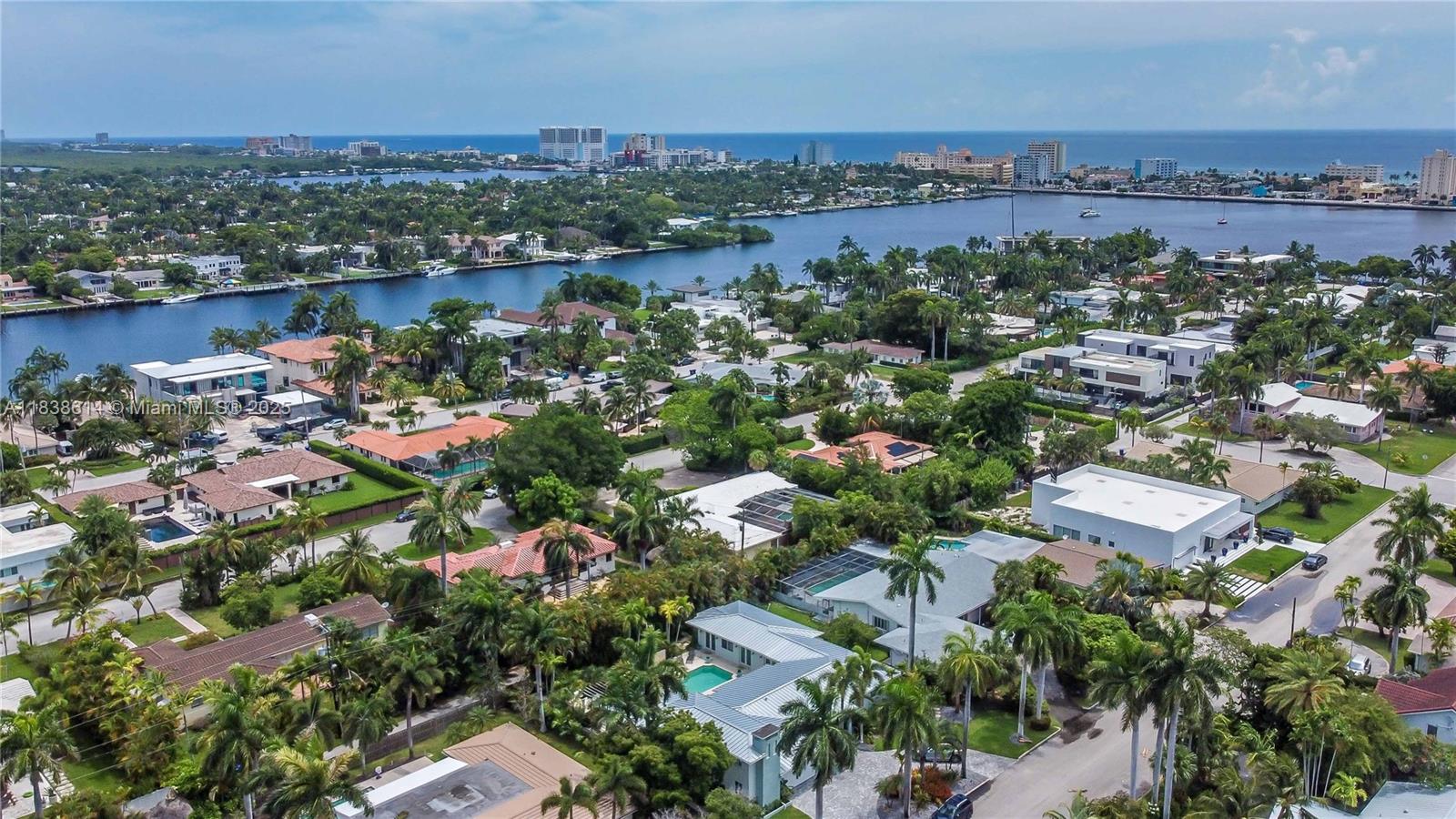 Incredible Opportunity! Hollywood Lakes home on a rare 112 x 138 double lot (over 15,000 sq ft)! Over 3,200 sq ft, this bright & spacious home offers 4 beds, 4 full baths, and a 1-car garage. Enjoy the oversized primary suite (800 sq ft) with a luxurious marble bathroom w/ a separate large walk-in shower, built-in sunken tub, double sinks, and 2 large walk-in closets. Eat-in kitchen includes a gas cooktop, double oven, breakfast nook, & plenty of natural light. Entertain effortlessly with a large pool, BBQ area, and spacious front driveway ( 9 cars) with Chicago brick and slate. Extra highlights include a split floor plan, two-zone A/C, tile roof, accordion shutters, and central vacuum. High elevation – never flooded. All this just 1.5 blocks from South Lake and close to the Intracoastal.