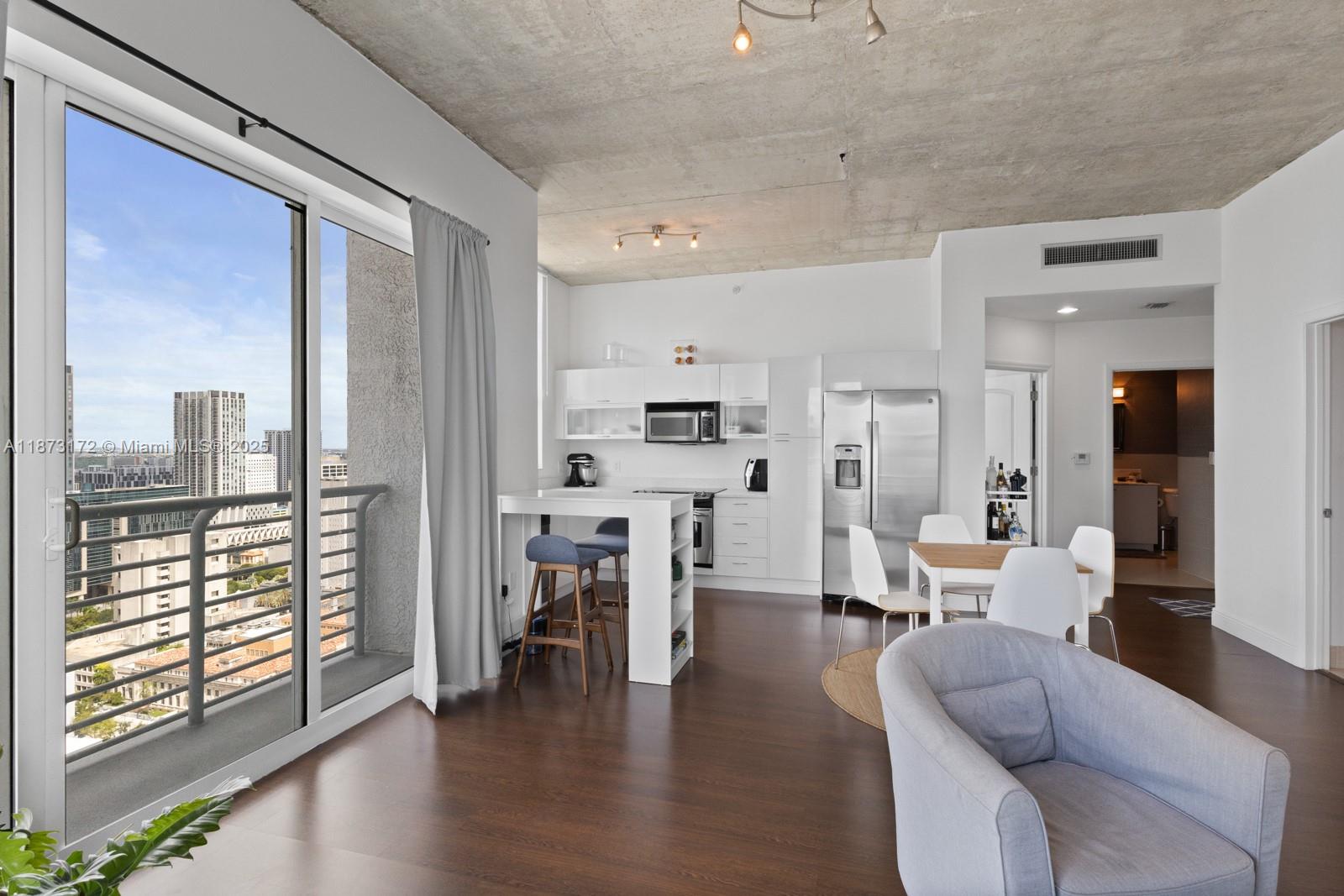 Live in the heart of Downtown Miami at LOFT 2! This beautiful 2 bed, 2 Full bath unit features a modern open kitchen, in-unit laundry, and elegant wood floors. Just steps from Bayside, Metromover, dining, and entertainment. Enjoy urban living with unbeatable location and style. Don't miss this one! Easy to show !!!!