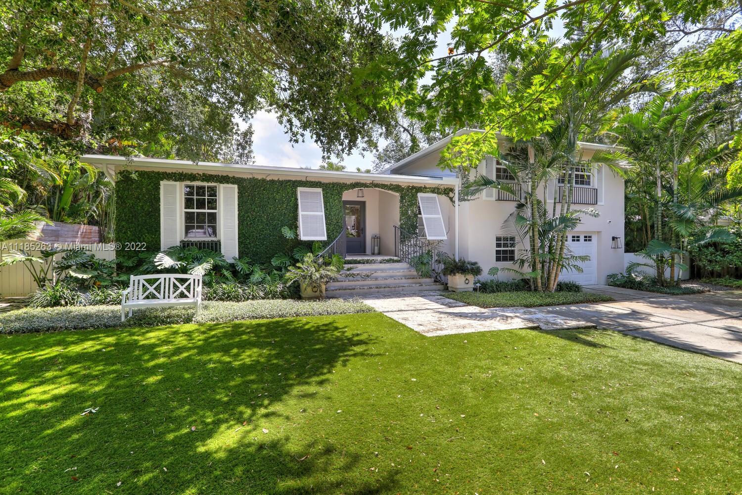 Lovely, walled & gated home on a quiet, tree-lined street just 1 block from Merrie Christmas Park. Light-filled living spaces feature wood & tile flooring, fireplace and custom built-ins & millwork throughout. Open floorplan layout offers 4BR’s/3.5BA’s + office/den. Extensively updated including: all impact glass, Surround sound system (inside & out), new roof, LED lighting, SWAT mosquito system & Smart Home features such as Nest thermostats. Stunning kitchen w/classic white wood cabinetry, quartz countertops, high-end gas range & charming breakfast room w/banquette seating. Ultra-private, resort-like backyard features new Summer Kitchen & pergolas, deep covered terrace and inviting, heated salt water pool. Close to the Grove village center’s boutiques, cafes and bayfront parks & marinas.