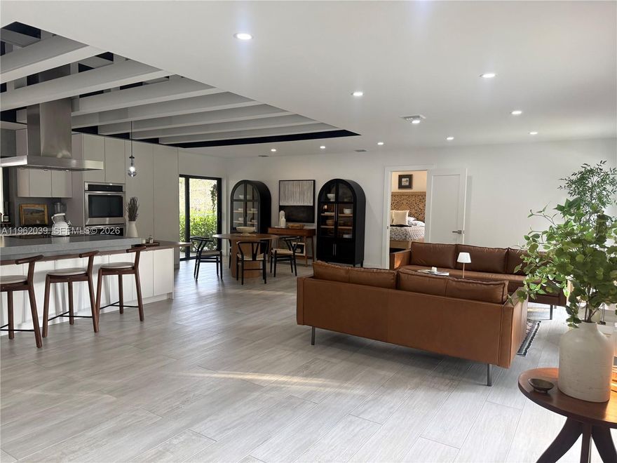 Beautiful modern home full of character, located on a quiet cul-de-sac in the desirable Plantation Acres South. Ideally situated near a park and scenic walking and biking trails, this residence offers privacy and a peaceful lifestyle.The home features an oversized pool and a serene backyard with canal views, ideal for relaxing or entertaining. A split floor plan provides excellent privacy for the spacious primary suite, complete with a private balcony, walk-in closet, and tranquil water views.The open-concept modern kitchen is the heart of the home and creates an impressive first impression upon entry, flowing seamlessly into the main living areas. The family room overlooks the deep blue oversized pool, filling the home with natural light.Additional features include impact windows and doors, new appliances, metal roof, new A/C system, laundry room, and 3.5 bathrooms.A must-see property combining modern design, comfort, and an exceptional location.