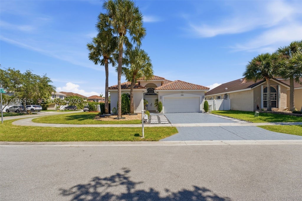 Photo of 1391 NW 185th Ter, Pembroke Pines, FL 33029 (MLS # A12096545)