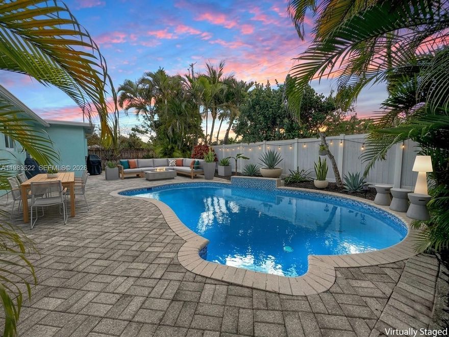 Welcome to your spectacular private fenced backyard paradise in a tropical setting with a refreshing pool updated in 2022 with new tile and liner, this is where you will enjoy your time. Updated 3 bedroom, 2 bathroom home with full impact windows and doors is filled with natural light throughout and elegant French doors lead to the outdoor space. Terrazzo floors bring a clean, classic South Florida vibe. The kitchen features white cabinetry, stainless steel appliances, granite countertops plus a reverse osmosis water system with a dedicated tap and line to the refrigerator. Both bathrooms have been tastefully updated. Major improvement completed in 2022 with trenchless lining of all cast iron sewer lines with 50 year warranty. Freshly painted carport and driveway with parking for up to 6 vehicles. No HOA. Easy access to I-95 and a convenient location near Wilton Manors, shopping, dining and approximately 5 miles to the beach for easy mornings and sunset evenings.