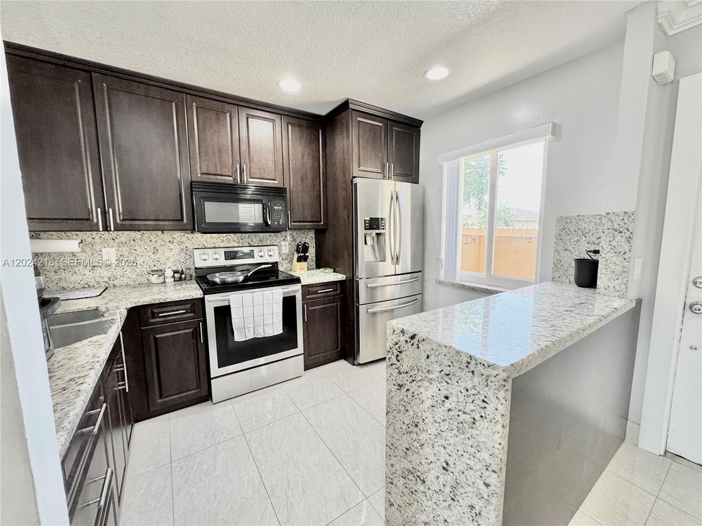 Photo of 10991 NW 30th Pl #10991, Sunrise, FL 33322 (MLS # A12024218)
