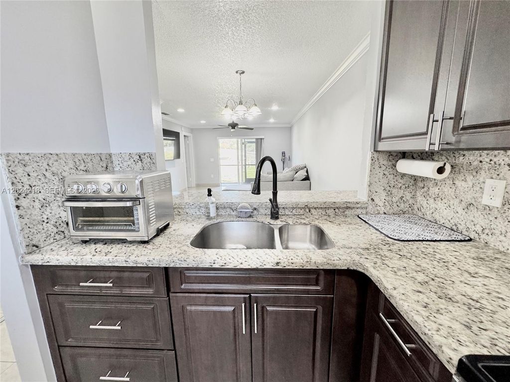 Photo of 10991 NW 30th Pl #10991, Sunrise, FL 33322 (MLS # A12024218)