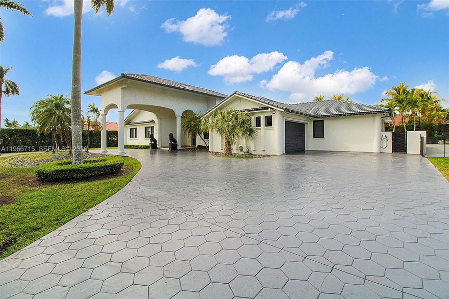 Stunning 5BR/5BA residence offers modern elegance and exceptional functionality. The sleek, modern kitchen and  bathrooms showcase high-end finishes throughout. Impact-resistant windows and new entry gates provide added security and peace of mind. Designed for entertaining, the backyard is a true showstopper featuring 5,000 sqft of marble flooring, a newly refinished pool with a slide and cascade, and a jacuzzi w/starlight ceiling, built-in pool bar. Inside, Spanish porcelain tile floors, expansive walk-in closets, and a split floor plan create comfort and versatility—perfect for an in-law suite or maid’s quarters. Situated on a large corner lot with top-tier security systems and multiple terraces for seamless indoor-outdoor living, this home blends luxury, privacy, and style. Natural Gas in the process of being installed.