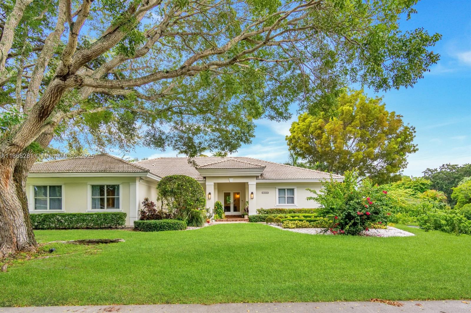 This gorgeous home will impress you at every corner. Walk into vaulted ceilings and beautifully updated living spaces. Impact windows and French doors lead you out onto an incredible covered patio area and steps away from a separate gazebo lounge fully equipped with a summer kitchen. You will love spending your days at this incredible property offering an estate sized lot with plenty of room for all of your grown up toys like boats and RVs, oh my. The spacious kitchen features plentiful cabinetry and quartz stone countertops. There are many incredible features like a separate laundry room, a cabana bath, both a primary and junior en-suite, walk in closets, built-ins & more. This is everything you have been dreaming about with an abundance of natural light and lush vegetation. Call today!