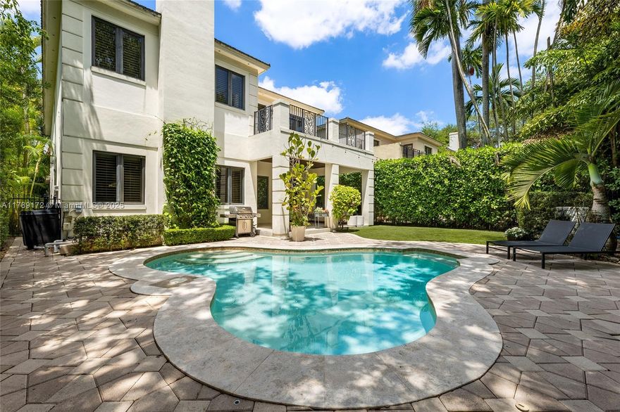 Located in a quiet, tree-lined neighborhood in north Coconut Grove, this elegant 2-story contemporary 5BR/5.5BA home sits on a gated, lushly landscaped 7,500SF lot. Home features 5,695 total SF, marble & rich hardwood floors, soaring ceilings, Sonos sound system & refined finishes. Ground floor offers a separate guest suite, large living & family rooms, formal dining room opens to courtyard w/fountain. Chef’s kitchen is equipped w/top-tier Viking & Sub-Zero appliances, granite countertops & breakfast area. Upstairs, a luxurious principal suite features dual walk-in closets, a spa-style bath & a private terrace overlooking the pool. The private backyard retreat boasts a pool, a covered terrace & lounge areas. Prime location-minutes to parks, marinas, shops/restaurants & top-rated schools.