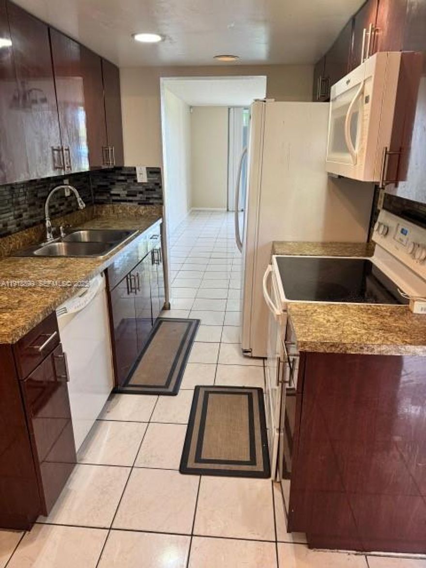 **PRICE REDUCED** SPACIOUS 2 BEDROOMS 2 BATHROOMS 1st FLOOR CONDO IN CYPRESS CHASE NORTH.  LAKEVIEW. GATED COMMUNITY.  TILED LIVING AREAS.  SCREENED PATIO.  WASHER/DRYER IN UNIT.  CLOSE TO SHOPPING AND TRANSPORTATION.  ALL-AGES COMMUNITY!!