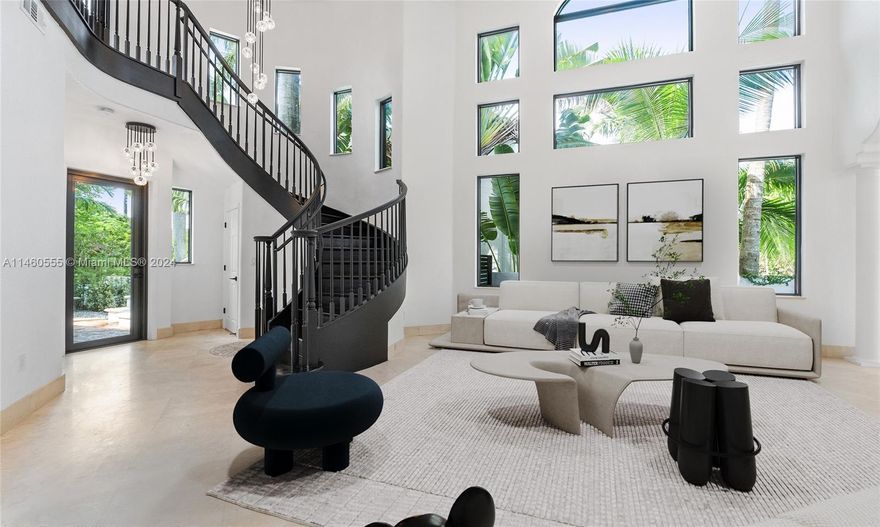 Beautiful Mediterranean home on prestigious La Gorce Drive. With its open concept, the residence offers the perfect blend of elegance and functionality. Featuring 5 bedrooms, 4 bathrooms, ceiling heights from 13ft- 20ft, hardwood floors, the interior exudes a sense of grandeur and warmth. Impact windows offer natural light, creating a welcoming inviting atmosphere. The open kitchen, complete with a breakfast nook, and upgraded appliances is a chef’s dream. Recent upgrades include new exterior lighting, impact doors and windows, salt water pool heater and pump, and a sprinkler system. The landscaped yard is a private haven with a pool and spa, making a perfect entertaining home. This home offers luxurious and convenient lifestyle, combining classic Mediterranean charm and modern amenities.