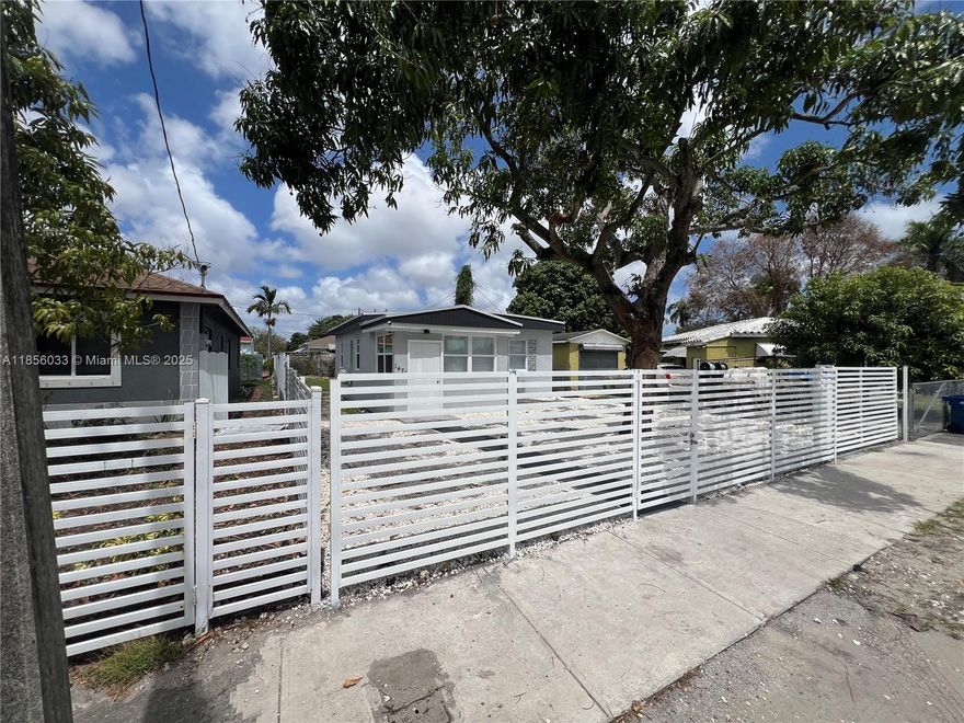 Beautiful remodeled offering modern style living. Features include sleek tile floors, recessed lighting, mini-split A/C units, and a stylish kitchen with updated cabinetry and fixtures. The bathroom is beautifully renovated, and the roof was installed in January 2025. Enjoy a gated yard with modern fencing, fresh paint, new windows, private parking, and low-maintenance landscaping. Located minutes from I-95, Wynwood, Midtown, and the Design District. This charming residence offers comfort, style, and functionality perfect for first-time buyers, downsizers, or investors.