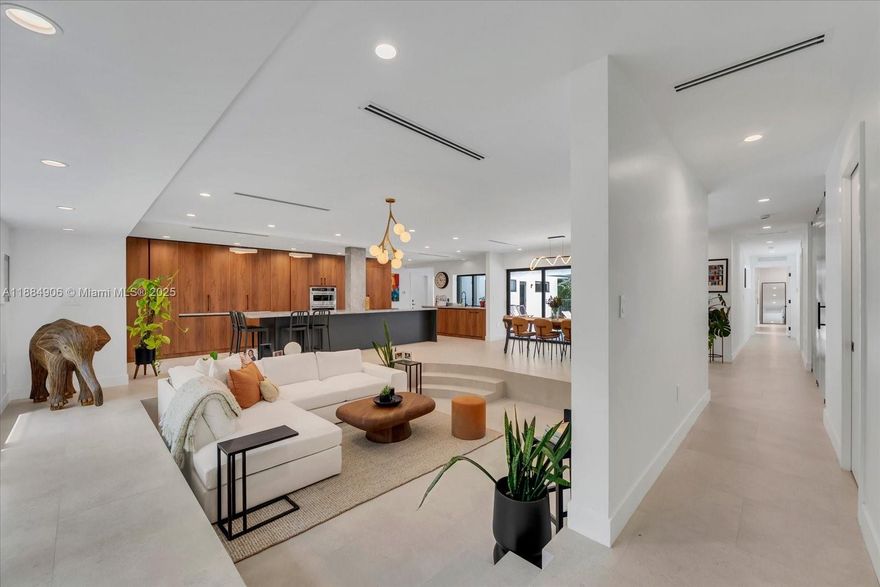 Where modern luxury meets mid-century charm, 3111 Anderson offers an unparalleled living experience in the heart of Coral Gables. This newly completed high-end renovation boasts 5 bedrooms and 5.5 bathrooms across 3650 sqft on a 1/4 acre double lot with sun filled open-concept living spaces. Highlights include a gourmet kitchen with premium appliances, Italian marble countertops and flooring, brand-new roof and MEP systems, new impact windows and doors, designer lighting, spa-like en-suite bathrooms with walk-in closets, and a spacious climate controlled 2-car garage with EV charger. Entertain in expansive indoor/outdoor spaces with a newly refinished pool. Just steps from Miracle Mile, the Biltmore and Coral Gables' recreation centers and parks, experience the best of the Gables!
