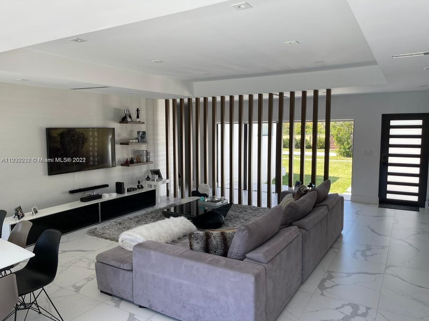 This newly fully remodeled 4/3 house is a gem located on the prestigious gated community Biscayne Point Island. All appliances and finished are top of the line, no expenses have been spared. 4 large bedrooms, 3 bedrooms, smart house all connected (Lights and A/C can be controlled by phone). Gorgeous Balinese outdoor area boasting a large swimming pool that is sunny all day long. Walking distance to Lehrman Community Day School.