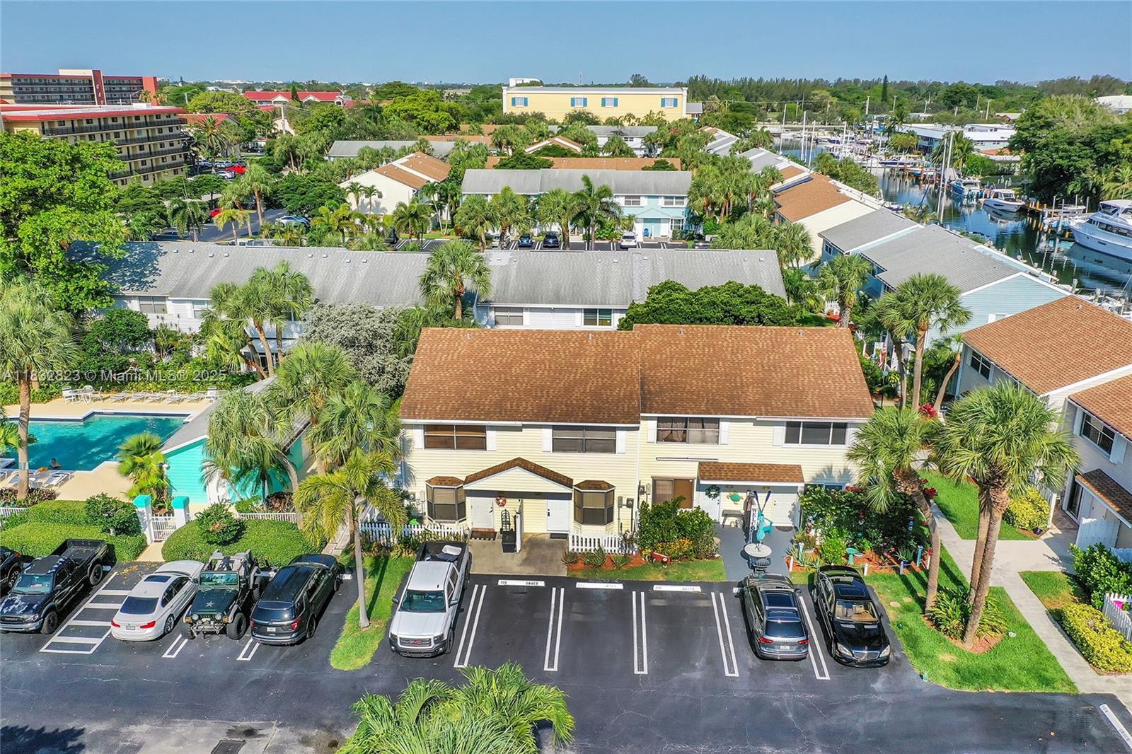 This totally updated 2-bed, 2.5-bath townhome in Pompano Beach offers stylish coastal living with a bright, open layout. No Special Assessments and Just 1.5 Miles from the Beach! The sunlit main living area showcases porcelain floors, modern finishes, plantation shutters, French doors and fenced back patio for privacy. Upstairs, you'll find a full-size washer/dryer. Includes 2 assigned parking spaces & ample guest parking. Enjoy the community pool & for boating enthusiasts, optional dock space is available for rent or purchase with no fixed bridges to the ocean. Golf course & inlet nearby. With low monthly maint. of just $218—including water, sewer, trash, landscaping—and the ability to rent immediately, this townhome is perfect for both personal enjoyment & investment potential.