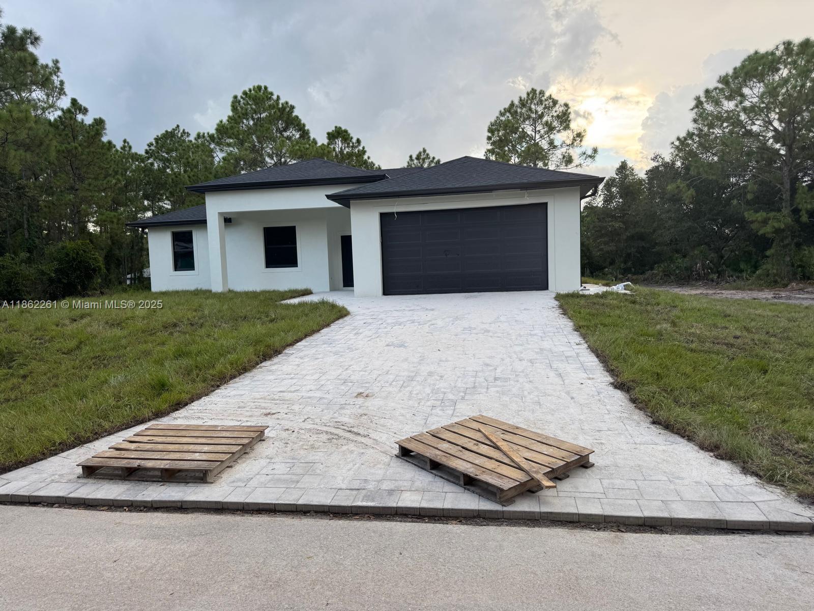 Seller Motivated. Single-family home, new construction (2025), located in Alva, FL, on the border with Lehigh Acres, in an area with no HOA restrictions. Perfect for truckers, as it allows for truck parking and animal keeping without limitations! This modern property features 4 bedrooms, 2 bathrooms, and a spacious 0.50-acre lot. Boasting luxury finishes, full porcelain tile flooring, and a modern kitchen with quartz countertops and high-end stainless steel appliances. Move-in ready, ideal for buyers seeking freedom, space, and superior quality. Seller motivated! Please schedule showings with 24-hour notice. A rare opportunity in a high-demand market!. The property will be ready in few weeks. We are ready to receive your best offer.