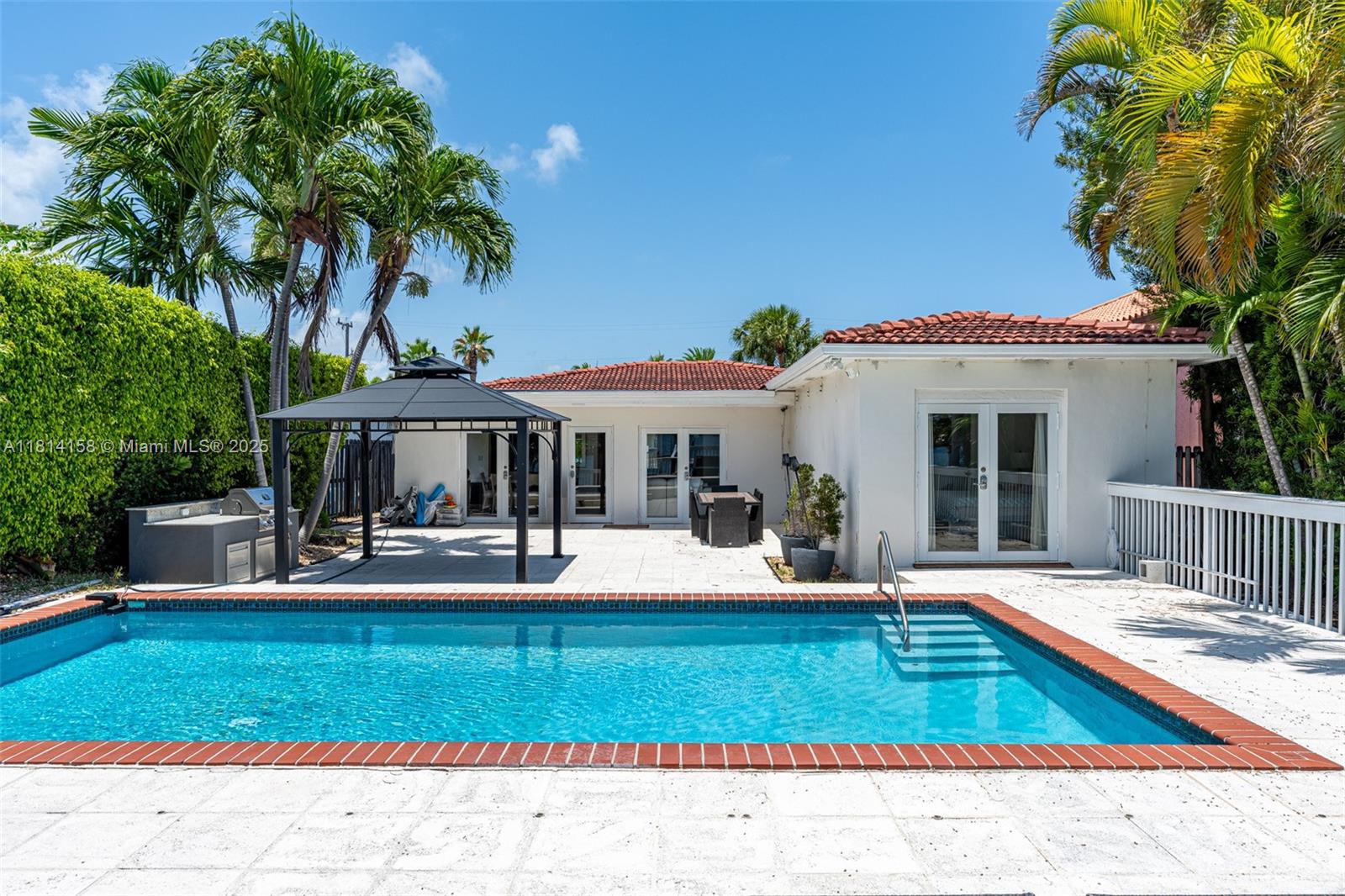 Leases for 3 month and up allowed! Furnshied Waterfront 4BD/2BA home in guard-gated Stillwater Island, Miami Beach. Features 50 ft of direct Biscayne Bay frontage with private dock—perfect for boaters. Bright open-concept layout with water views, modern kitchen with stainless steel appliances, and spacious bedrooms. Primary suite offers backyard access and bay views. Enjoy indoor-outdoor living with a large patio and lush landscaping. Includes laundry room, hurricane-impact windows, central AC, and ample parking. Minutes from beaches, Bal Harbour, dining, and top schools. Available now. Pets allowed with approval. Lawn, pool maintenance, and gas are included in the rent price.
