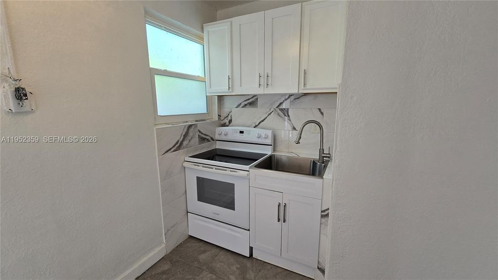 Photo of 9680 NW 19th Pl, Sunrise, FL 33322 (MLS # A11952359)