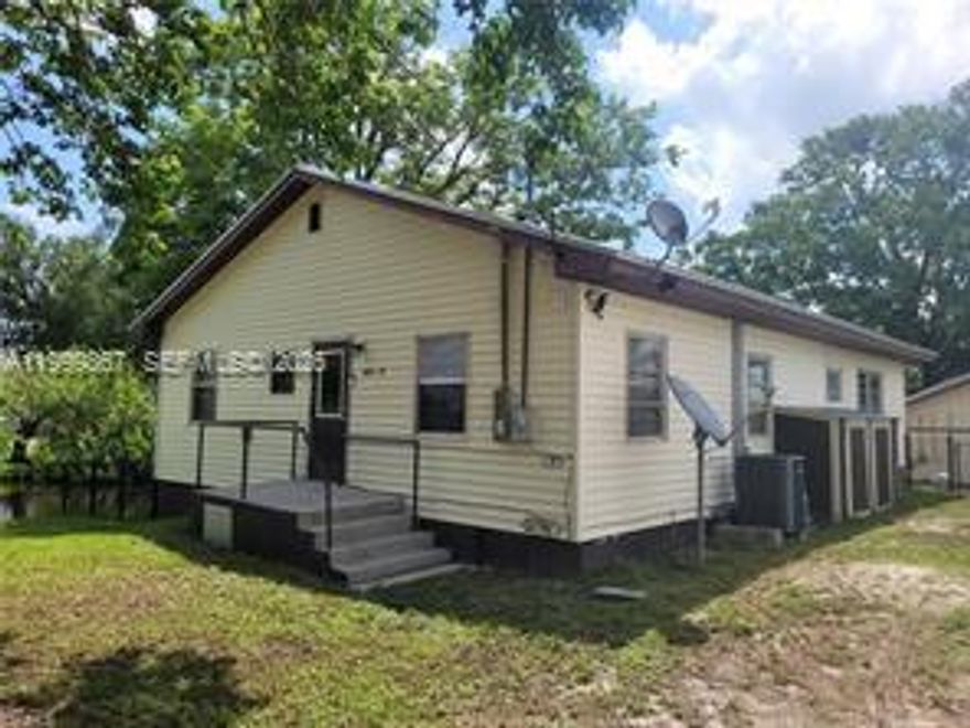 Calling all Fishermen and Fisherwomen! Own your very own fish house in Moore Haven. Located on a corner lot at an intersecting canal you will find this sweet 4 bedroom 1.5 bath home with a fenced yard. The sea walled lot is fenced and completed with your very own boat house. There are beams in the boat house which would allow for a lift to be installed. Inside your happy home there are 4 bedrooms offering plenty of room for guest to join in on the fishing fun! A great little screened porch overlooks the canal for relaxing views. There is 1 small bridge to go under before you are on the Caloosahatchee River and then onto Lake Okeechobee. Make this Fabulous Fishing Paradise yours. Call and schedule your showing soon!