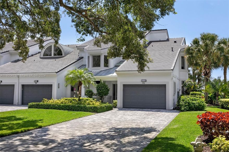 Fully renovated gem in highly sought after Admirals Cove offers 2 BRs, 2 BAs, Den (readily convertible to 3rd BR) & private Boat Slip. Home features NEW: impact windows & sliders, a/c, water heater, & exterior roof, pavers & painting (enhancing its inviting curb appeal).  Open floor plan seamlessly connects living areas. Kitchen features custom cabinetry & top of line appliances. Porcelain floors (wood appearance).  Expansive views of golf course, range & navigable waterway. Close proximity to Club facilities & amenities.  Pool w/ grille & fire pit exclusive to Spyglass Way owners.  Short distance to Club resort style facilities & amenities, incl:  Golf, Tennis, Pickleball, Marina, Spa, Fitness, multiple Dining venues, yr-round kid's program, on-site bank, & boutique hotel.