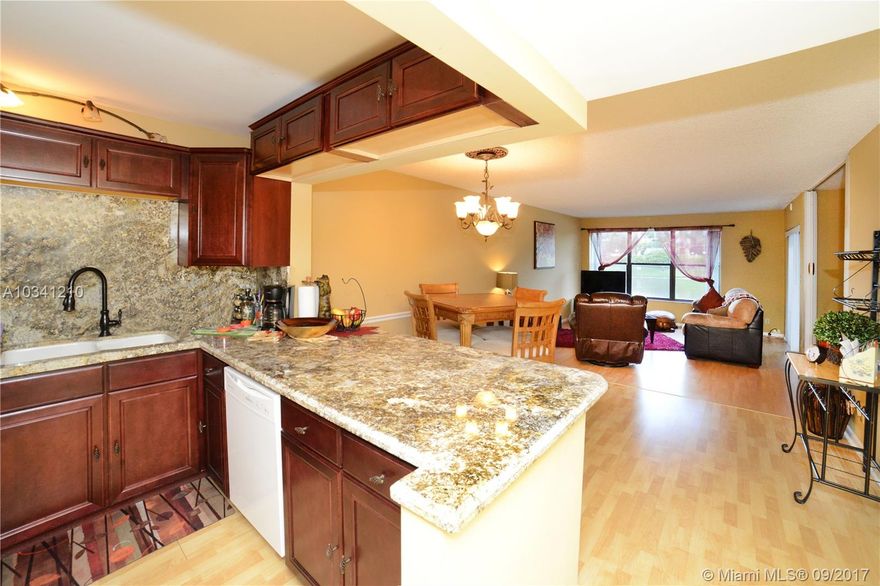 Look no further! Gorgeous & completely remodeled 3/2. Conveniently located on the 1st floor with the loveliest lake views. Fabulous wood floors throughout this residence. The kitchen has beautiful granite counter tops, custom wood cabinets, new appliances & huge island/bar. Wonderful baths with glass shower enclosures, custom vanities, designer tile, marble, & stone work. Custom lighting throughout. Huge screened patio serene & peaceful lake views. Top notch community w/ pool, tennis, playground & more!