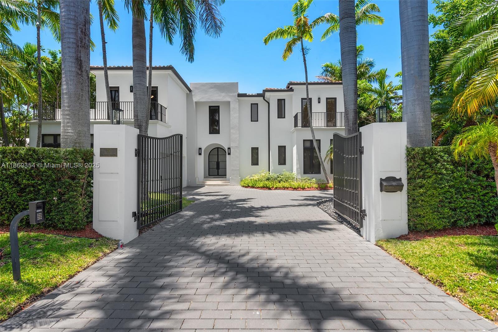 Experience elevated luxury in this stunning estate located in the famous Bal Harbour Village, one of South Florida’s most prestigious gated communities. Boasting over 6,200 sq ft of elegant living space, this 6-bedroom, 6.5-bath home features soaring ceilings, a private elevator, and a gourmet kitchen with top-of-the-line appliances. The expansive primary suite offers a spa-like bathroom and custom walk-in closet. Perfect for entertaining, enjoy seamless indoor-outdoor living with a heated pool, spa, covered terrace, and beautifully landscaped grounds. Steps from the iconic Bal Harbour Shops—one of the world’s most famous shopping destinations—and ideally located between Sunny Isles, Surfside, and Miami Beach. Minutes from beaches, top schools, a private marina, and fine dining.