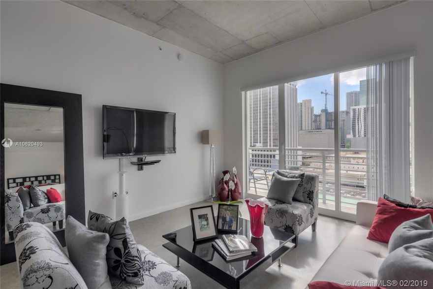 Great Value! Magnificent & spacious, largest one bedroom in the building! Walk into this loft residence which expands into a vast open concept featuring concrete floors, 10 foot ceiling, open kitchen, in-unit washer/dryer, and large walk-in closet. Lots of natural light, this floor plan is unique, only one available per floor. Building features 24-hr front desk attendant, secured entry, parking, roof top pool and gym, lap pool, rec room and more. Be part of the Urban movement, make Downtown Miami your home. Lots of growth in the area. Call now to view this great buy!