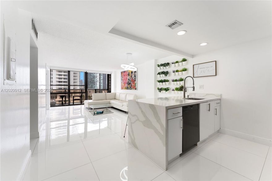 Renovated waterfront 2 bedroom 1.5 bath unit at the Charter Club Condo in Edgewater, Miami. Enjoy your water views and in unit washer/dryer. Building amenities include pool, gym, sauna, tennis courts, basketball court, convenience store, 24/7 front desk/security, and ample complimentary guest parking. Walk to trendy restaurants & shops in the Design District, bike to South Beach, Wynwood, Brickell, or Downtown Miami, or enjoy world-class performances at the Adrienne Arsht Center. Miami International Airport is approximately 15 minutes away. Building undergoing renovations. Special Assessment will be paid in full at time of closing!