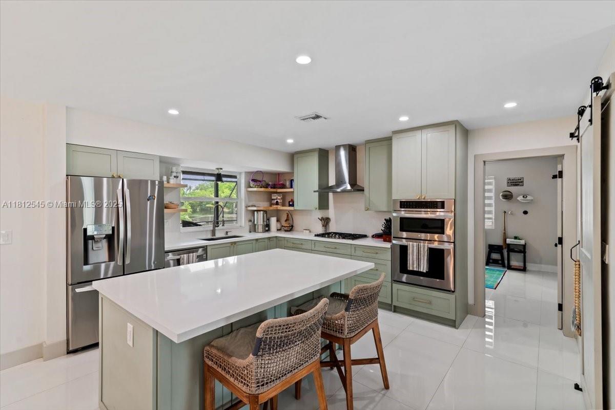 $5,000 closing cost credit available with Chase Bank!
This beautifully renovated 4-bedroom, 3-bath home sits on a large 10,398 sq ft lot with serene lake views in the heart of Pembroke Pines. Featuring two master suites, it’s perfect for multigenerational living or guests. Enjoy peace of mind with a new roof (2021), impact windows and doors, updated electrical and plumbing, and a new A/C unit. The stylish kitchen has stainless steel appliances and flows into open living spaces with tile and polished concrete floors. Located in Pembroke Lakes, a sought-after community close to parks, shops, and top schools.
Hometown Heroes program approved. Don’t miss this one!
