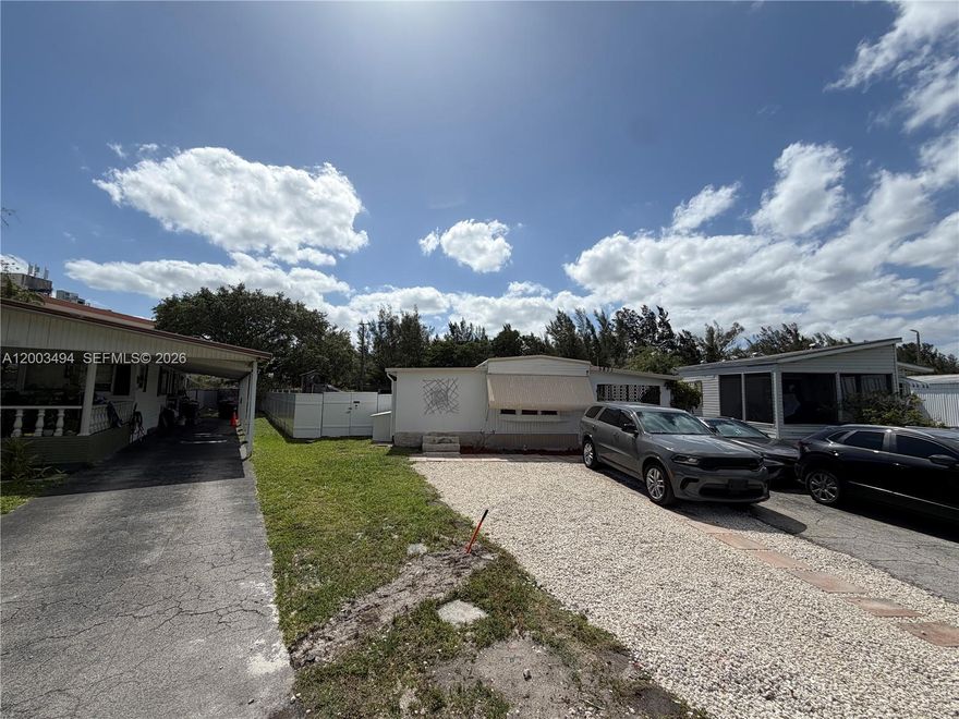 Spacious 2-bedroom, 2-bath mobile home located on a 5,256 sq ft oversized lot in Ravenswood Estates & Marina, an all-ages community where you own the land. Enjoy access to resort-style amenities including a pool, tennis courts, fitness center, & more. Built in 1987, this home offers a great opportunity for buyers to update and make it their own or purchase for the lot and add a new home. Features include an aluminum roof, Florida room, and a dedicated utility/laundry area, providing a functional starting point for renovation or future plans. The spacious lot offers plenty of room to enhance and create your ideal outdoor space. No rentals permitted during the first 3 years of ownership per HOA guidelines. Don’t miss this chance to invest in a well-located community with strong potential.