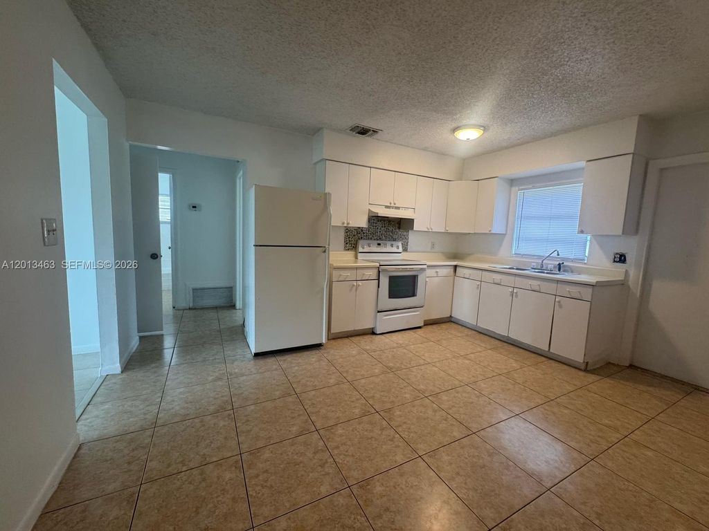 Photo of 1480 NW 19th Ct #1-2, Fort Lauderdale, FL 33311 (MLS # A12013463)